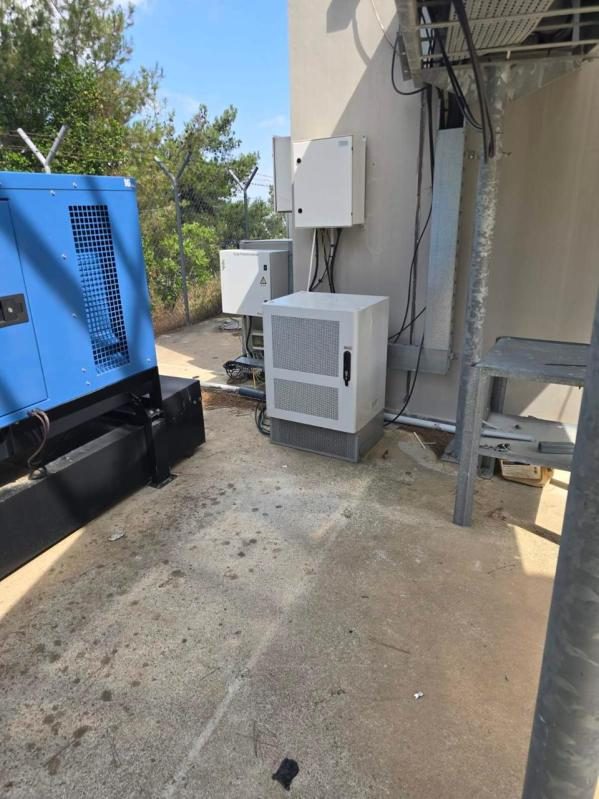 Site with outdoor cabinet and backup generator